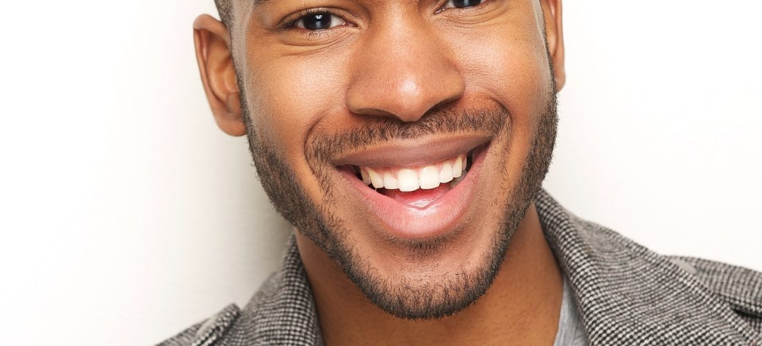 Close up portrait of a happy young man smiling